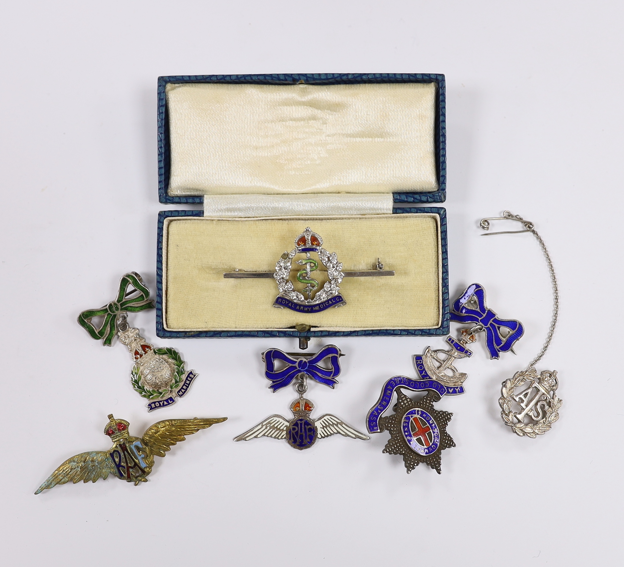 Seven white metal etc. enamelled sweetheart and related brooches, examples including; RAF, Royal Navy, RAMC, Royal Marines, etc.